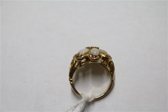 A 1970s 9ct gold, white opal and ruby cluster dress ring, size M.